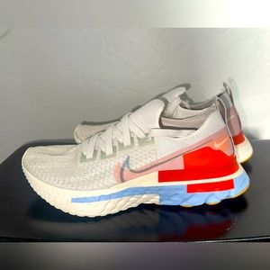 Nike women’s shoes react white, orange, blue sneakers